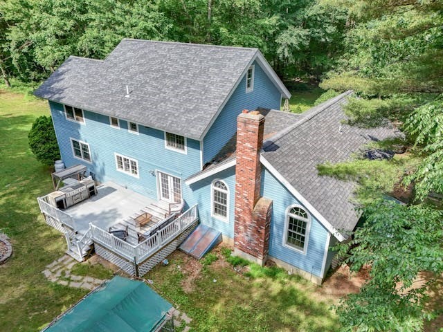 210 New Boston Road Sturbridge, MA 01566 - Photo 41 of 42 an aerial view of a house with balcony and outdoor seating