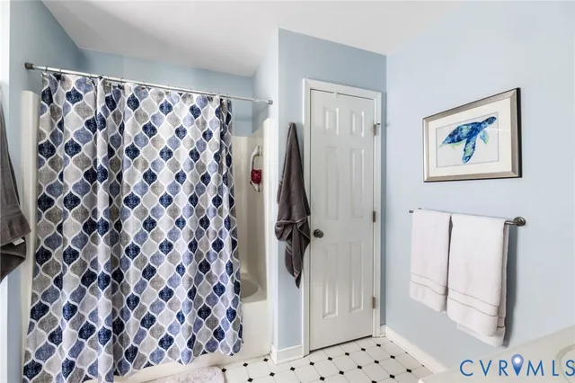 a bathroom with a shower curtain