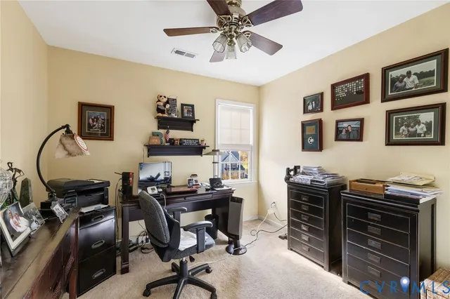 a view of a workspace with furniture