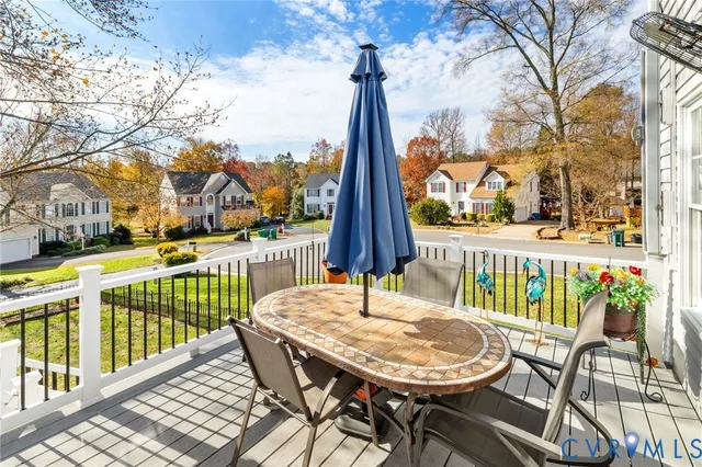 a view of a chairs and table on the deck