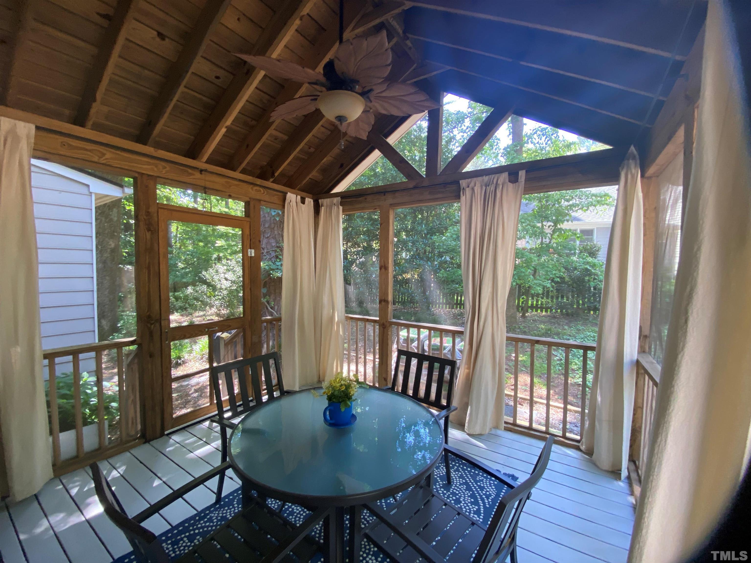 4728 Worchester Place Raleigh, NC 27604 - Photo 7 of 7 a view of a room with furniture wooden floor and a potted plant