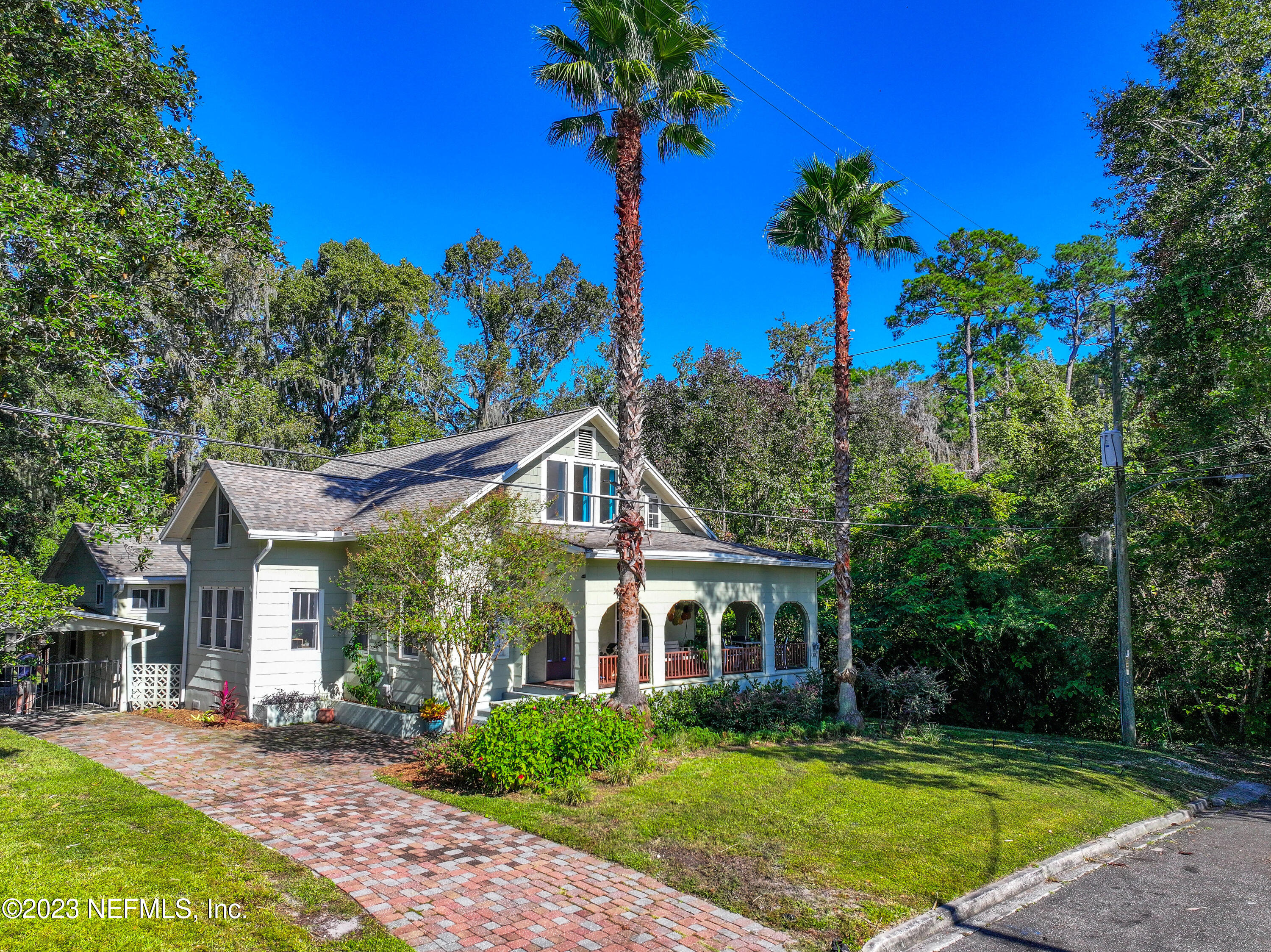 3803 Valencia Road Jacksonville, FL 32205 - Photo 1 of 58 a front view of a house with a garden