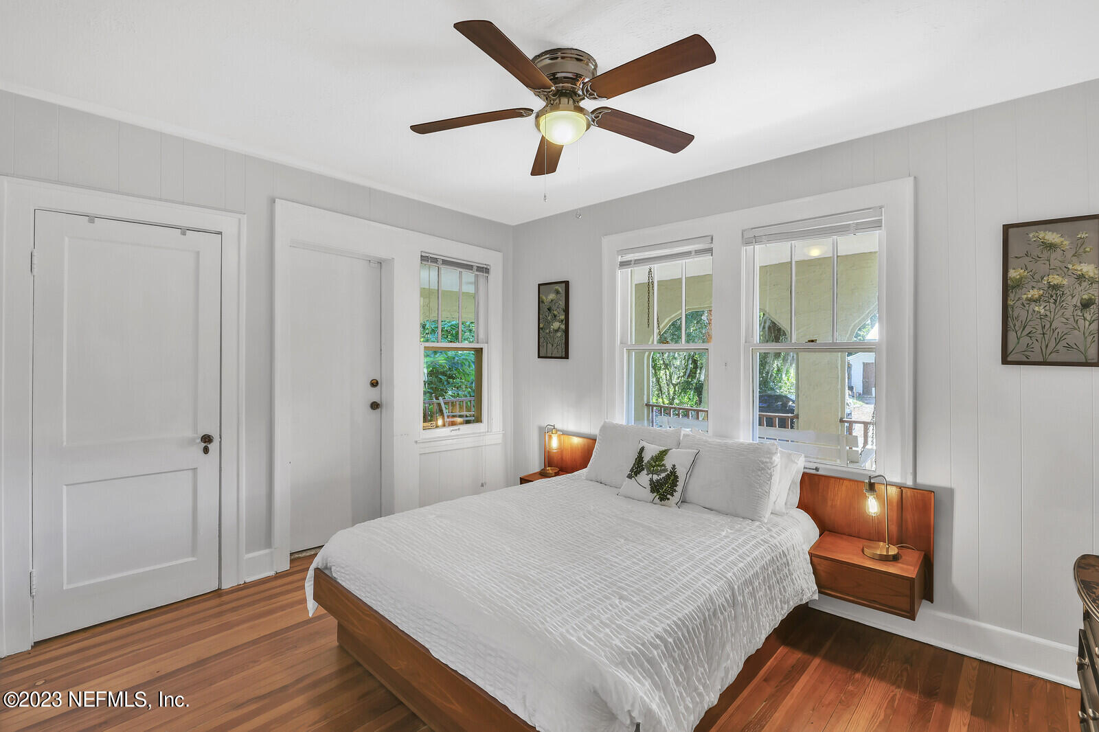 3803 Valencia Road Jacksonville, FL 32205 - Photo 17 of 58 a bedroom with a large bed and a large window