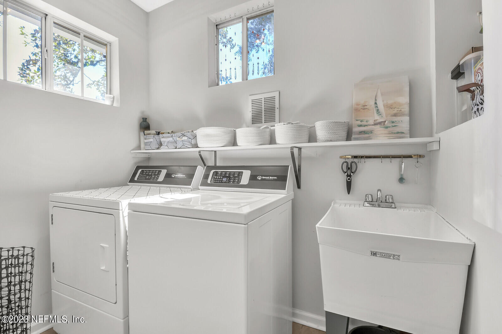 3803 Valencia Road Jacksonville, FL 32205 - Photo 20 of 58 a utility room with dryer and washer