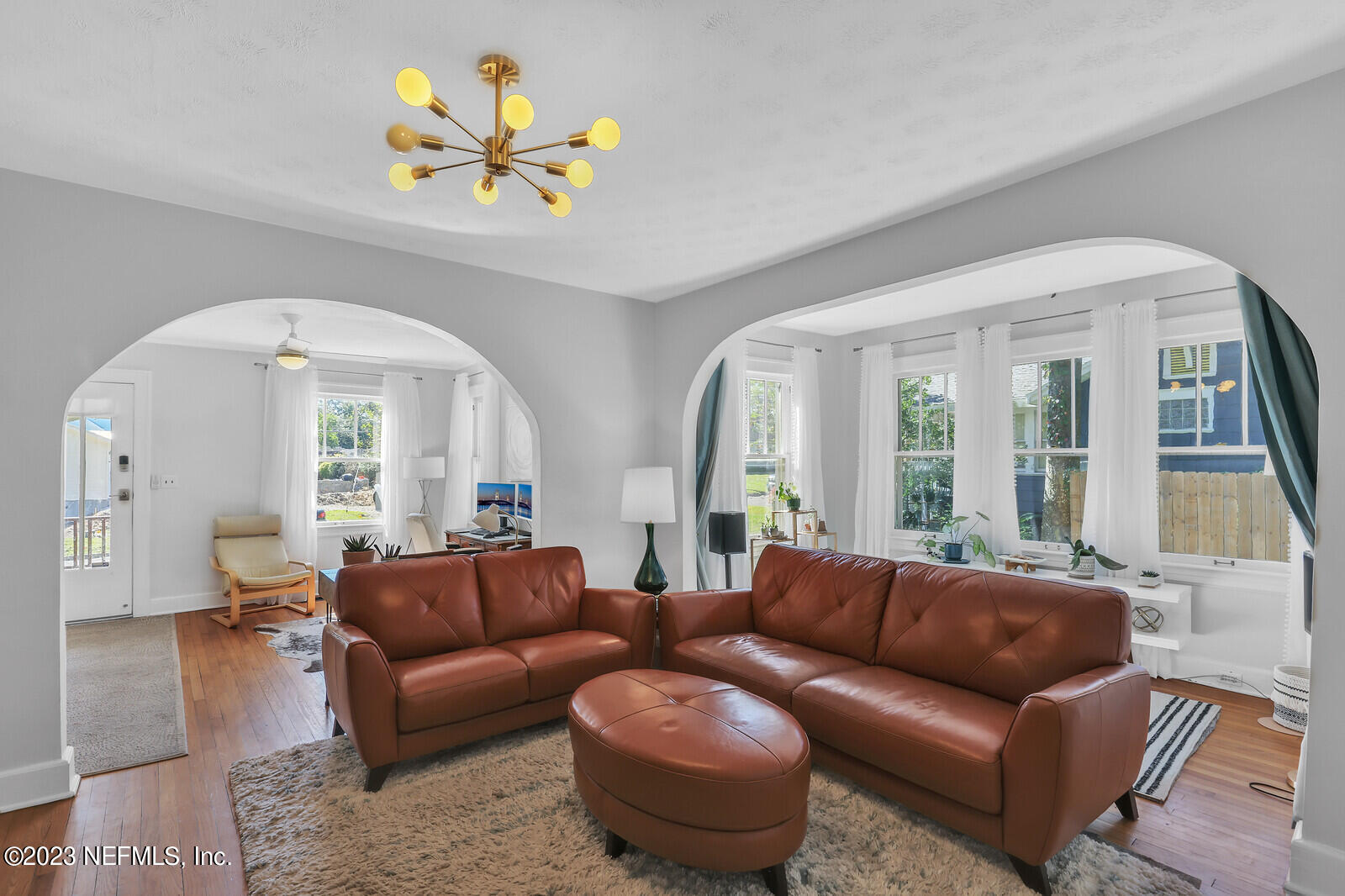 3803 Valencia Road Jacksonville, FL 32205 - Photo 2 of 58 a living room with furniture and a large window