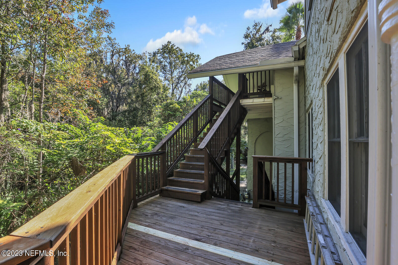 3803 Valencia Road Jacksonville, FL 32205 - Photo 21 of 58 a view of a balcony with wooden floor and stairs