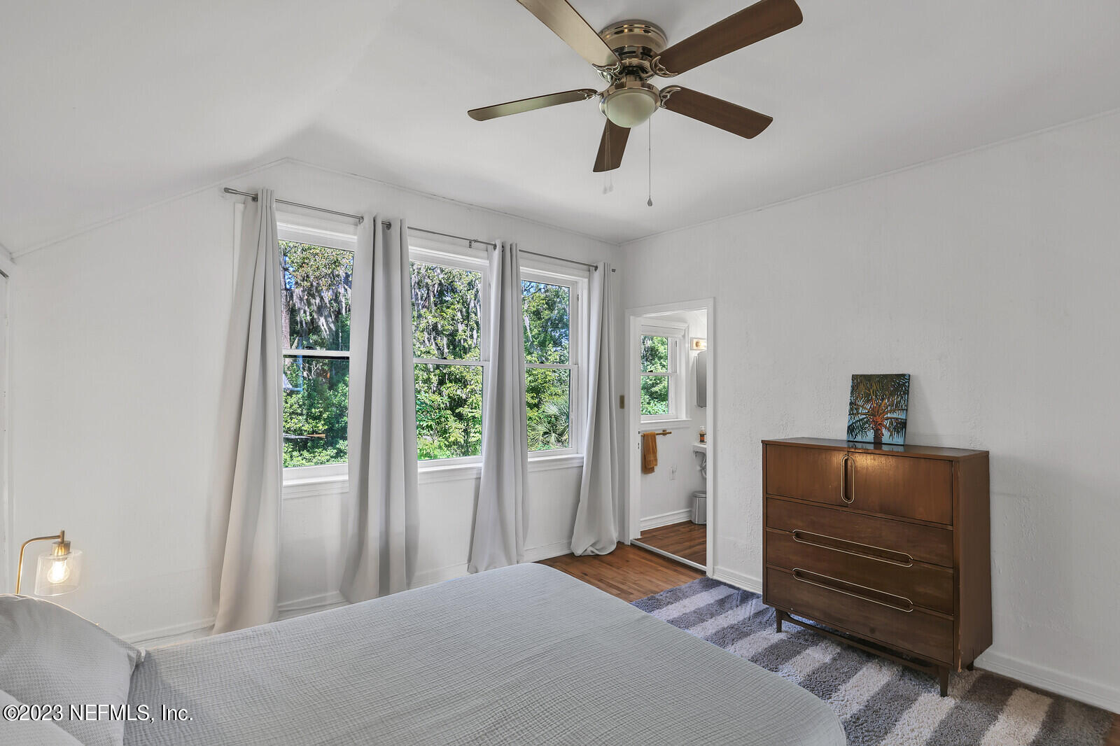 3803 Valencia Road Jacksonville, FL 32205 - Photo 28 of 58 a bedroom with furniture and large windows