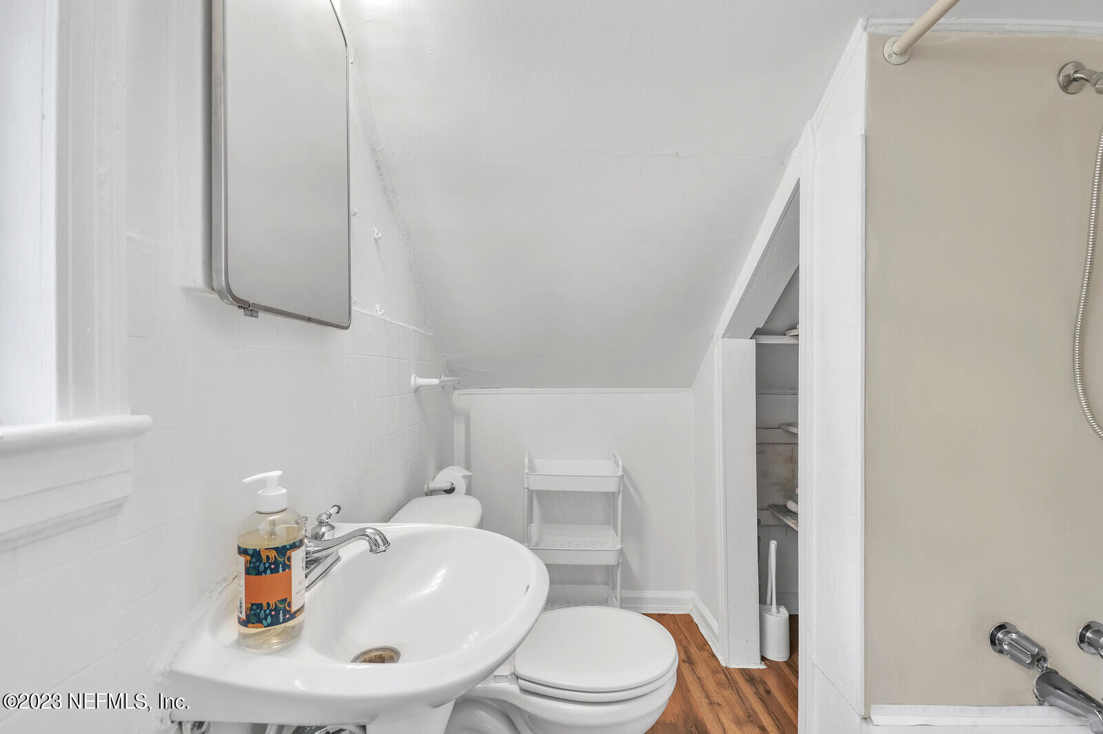 3803 Valencia Road Jacksonville, FL 32205 - Photo 29 of 58 a bathroom with a sink a toilet and mirror