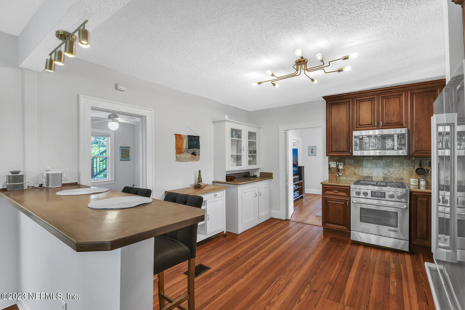 3803 Valencia Road Jacksonville, FL 32205 - Photo 3 of 58 a kitchen with stove a sink and refrigerator