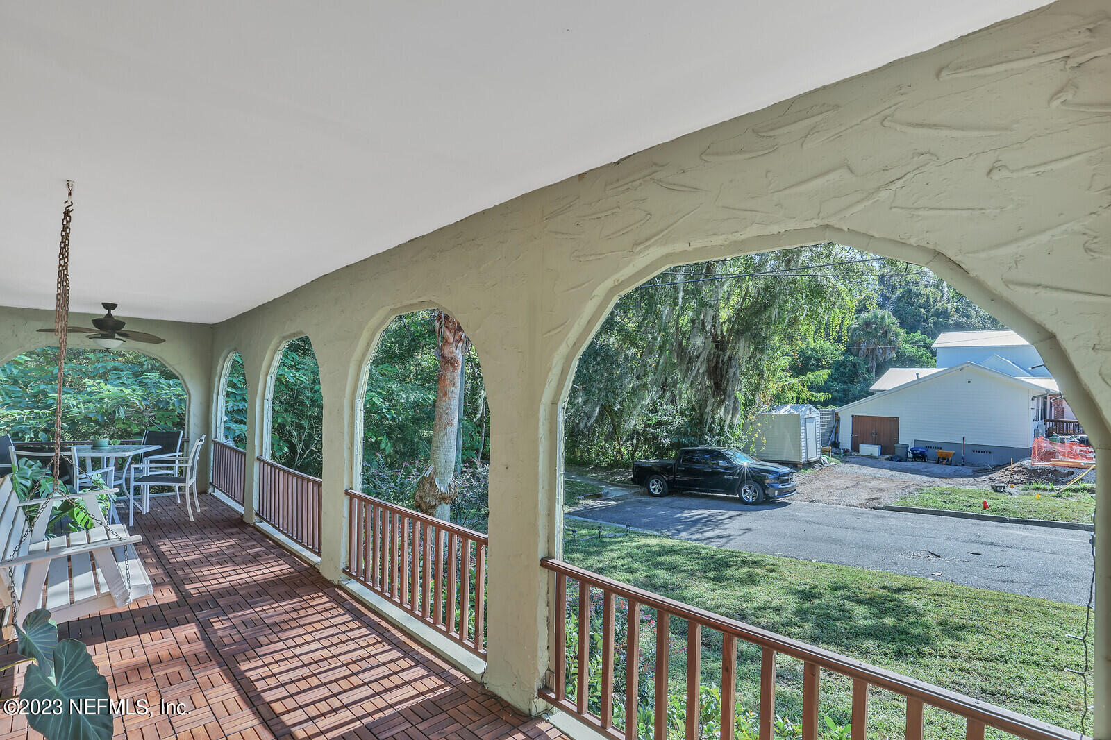 3803 Valencia Road Jacksonville, FL 32205 - Photo 32 of 58 a view of a porch with furniture and garden
