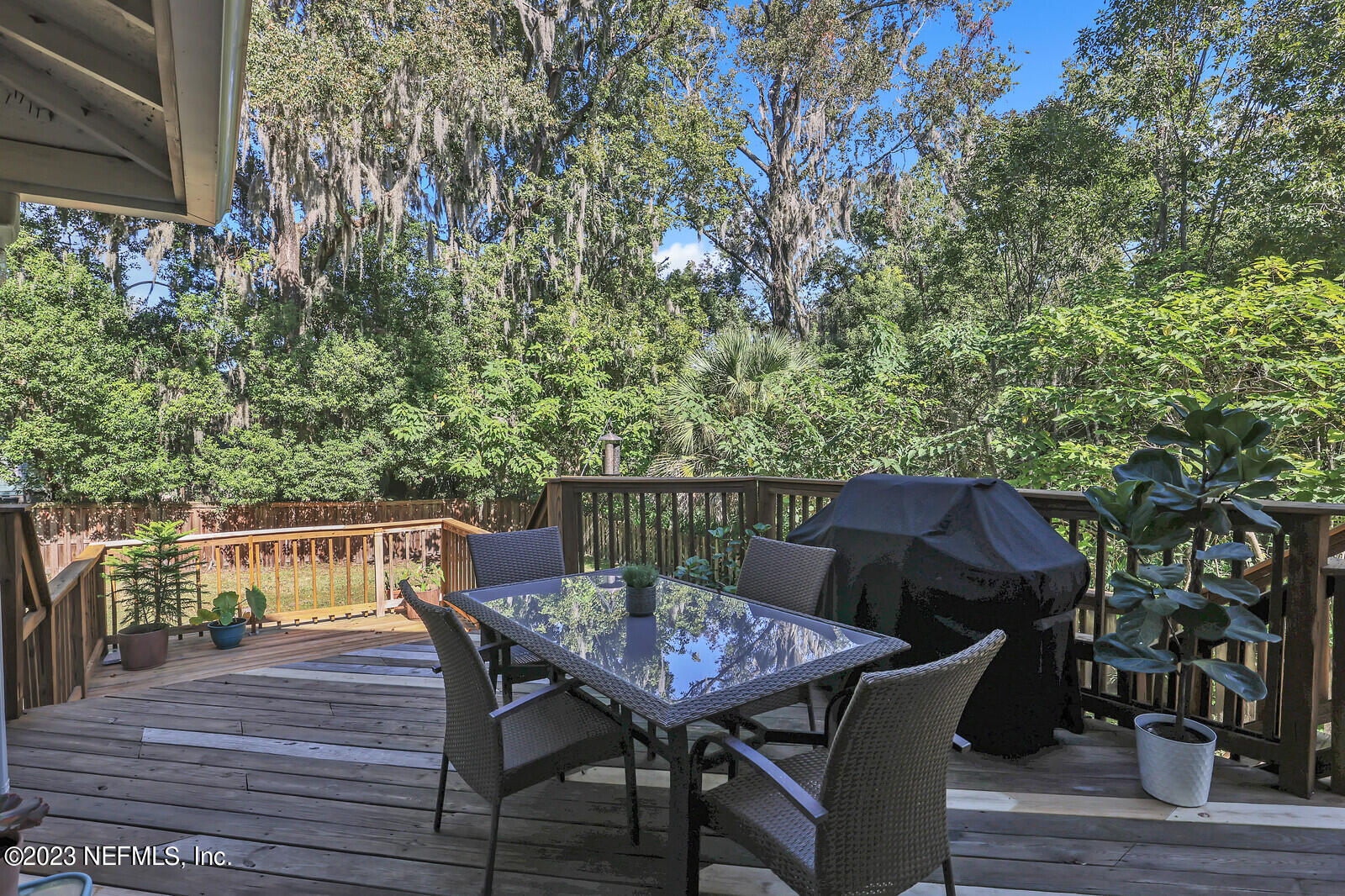 3803 Valencia Road Jacksonville, FL 32205 - Photo 36 of 58 a balcony with wooden floor table and chairs