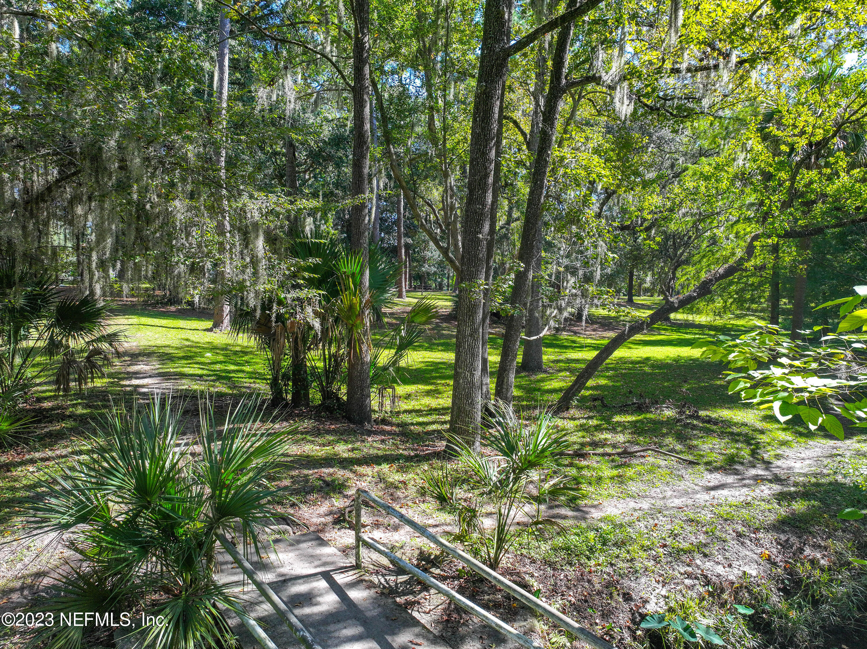 3803 Valencia Road Jacksonville, FL 32205 - Photo 52 of 58 a backyard of a house with a yard and outdoor seating