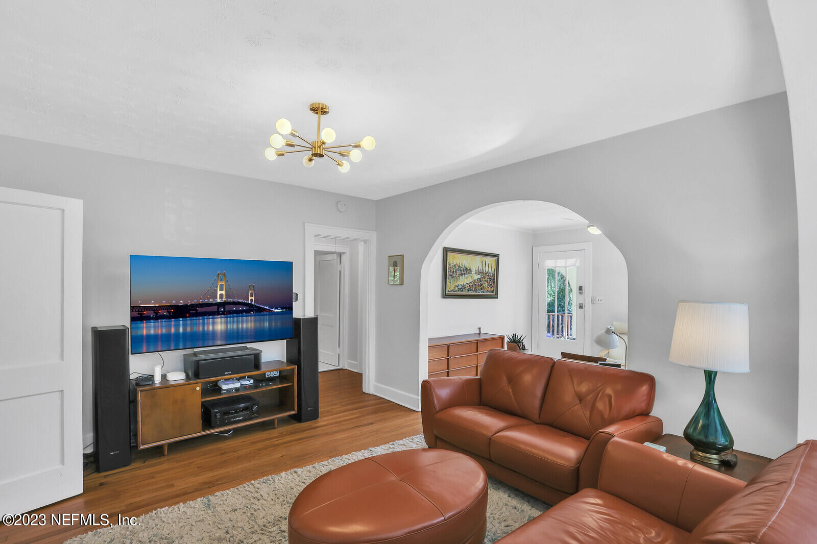 3803 Valencia Road Jacksonville, FL 32205 - Photo 7 of 58 a living room with furniture a flat screen tv and a window