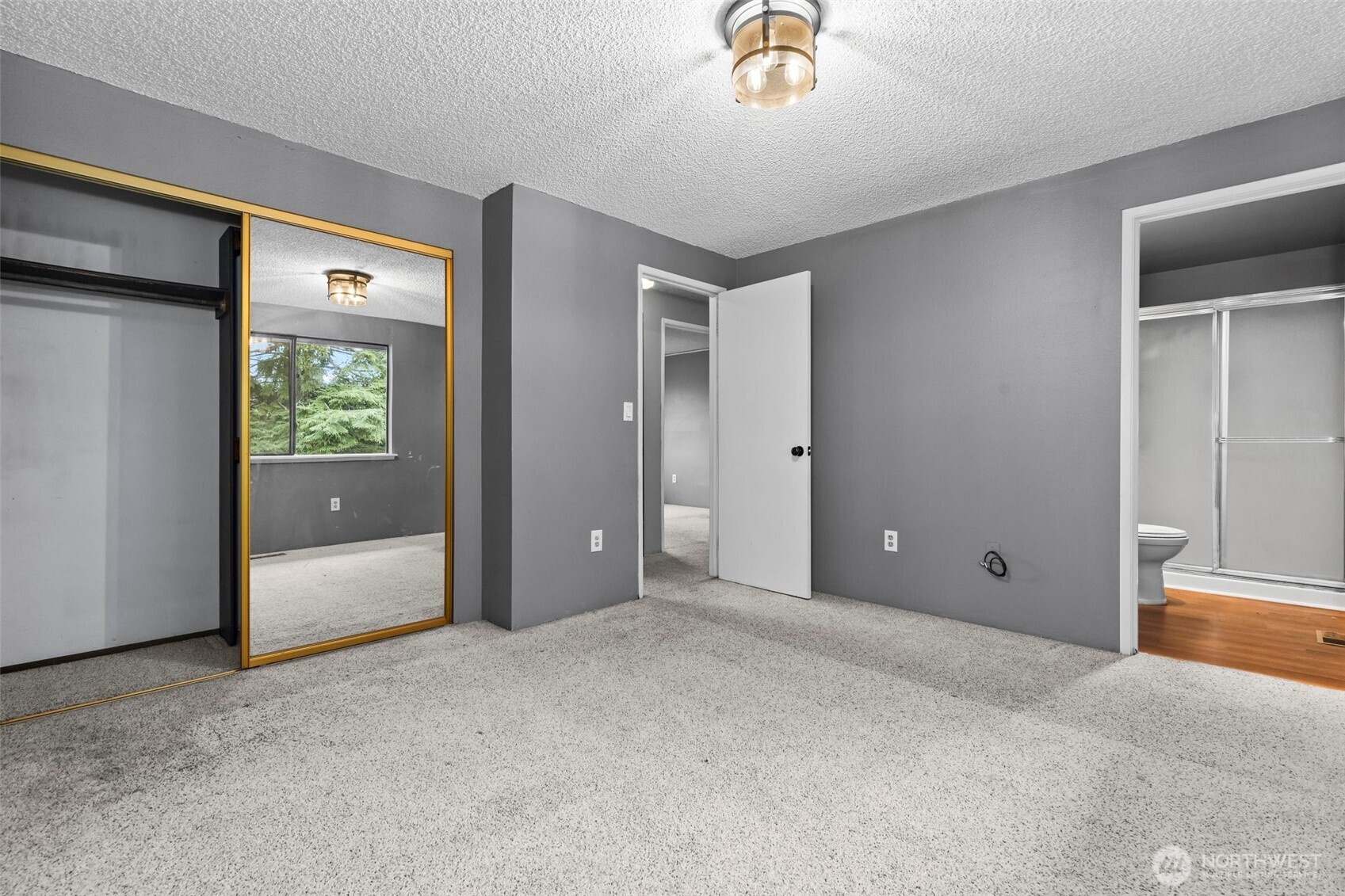 10329 99th Street Southwest Tacoma, WA 98498 - Photo 13 of 25 an empty room with windows and closet