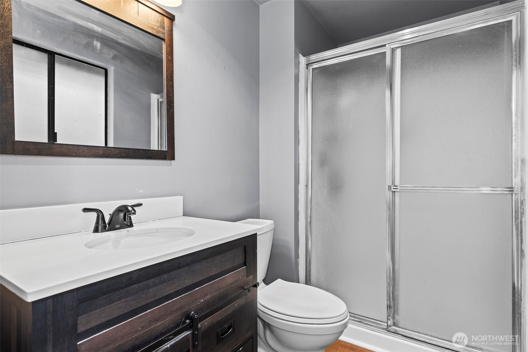 10329 99th Street Southwest Tacoma, WA 98498 - Photo 14 of 25 a bathroom with a sink a toilet and shower