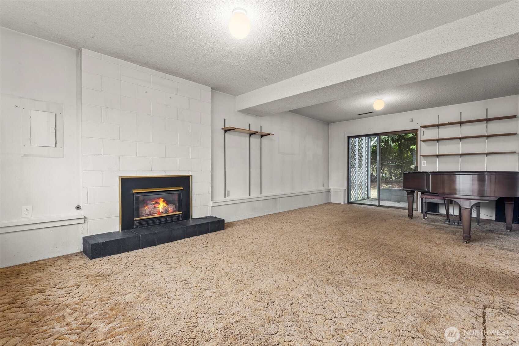 10329 99th Street Southwest Tacoma, WA 98498 - Photo 16 of 25 a living room with furniture and a fireplace