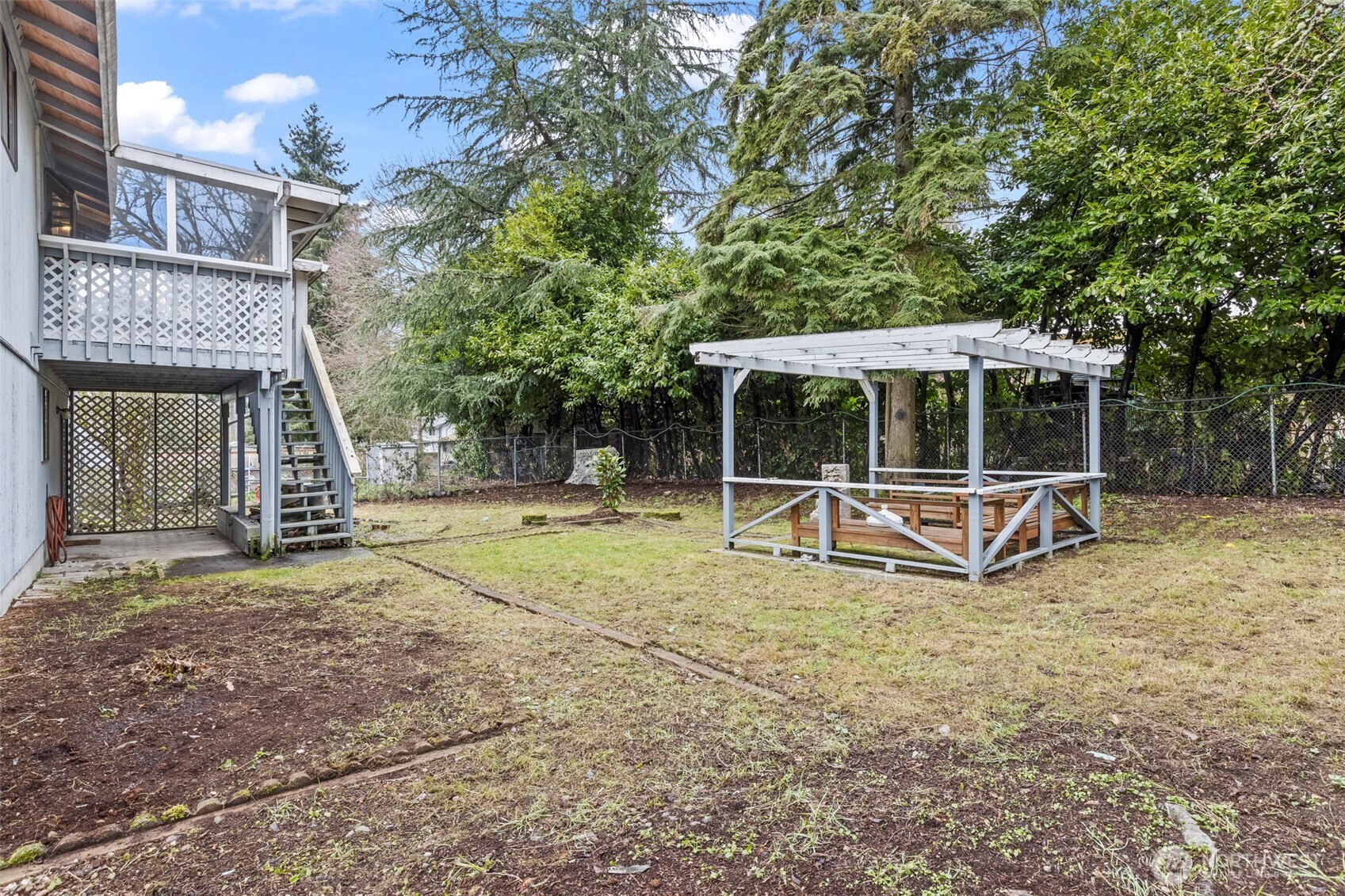 10329 99th Street Southwest Tacoma, WA 98498 - Photo 22 of 25 a view of a house with backyard and porch