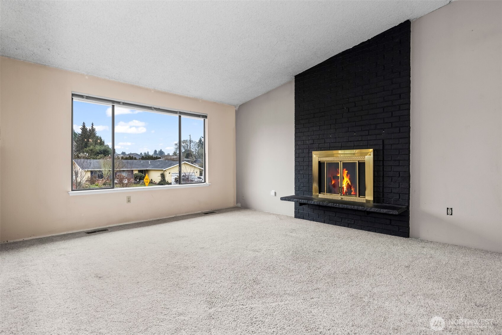 10329 99th Street Southwest Tacoma, WA 98498 - Photo 3 of 25 a view of an empty room with a window