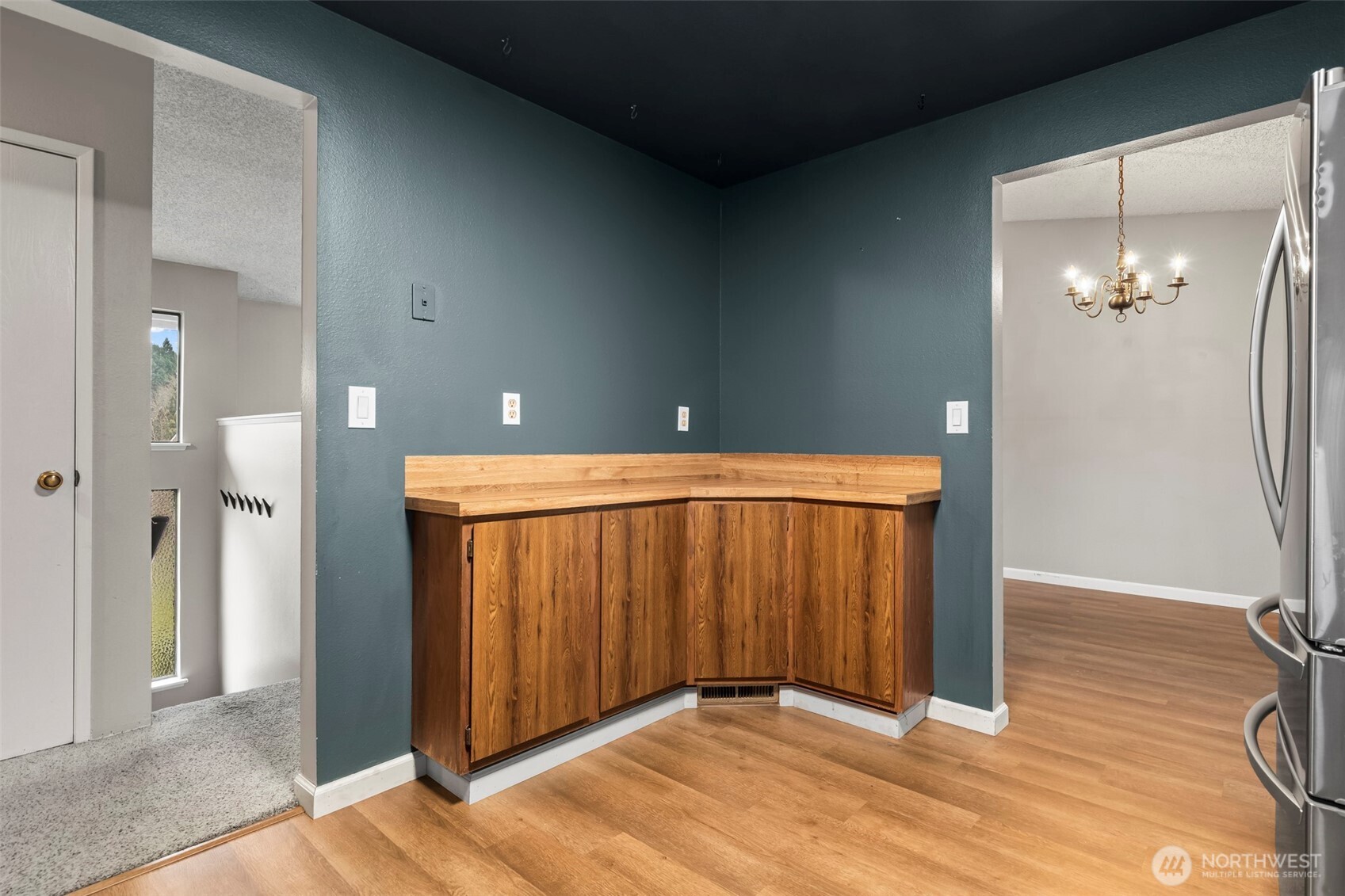 10329 99th Street Southwest Tacoma, WA 98498 - Photo 8 of 25 an empty room with wooden floor and mirror