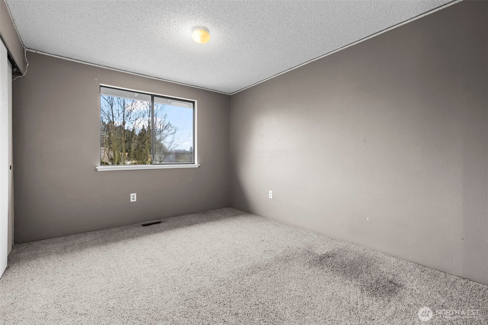 10329 99th Street Southwest Tacoma, WA 98498 - Photo 10 of 25 an empty room with windows