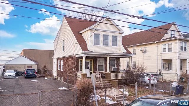a view of house with a patio