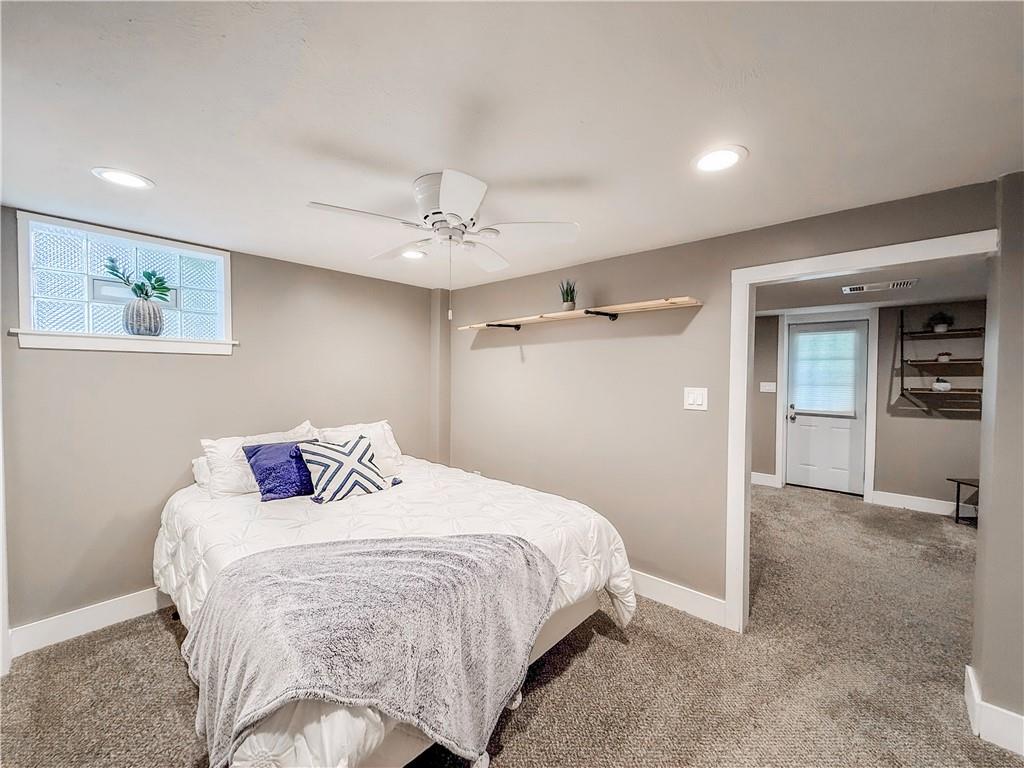 650 Lindsay Road Carnegie, PA 15106 - Photo 13 of 35 a bedroom with a bed and a chandelier