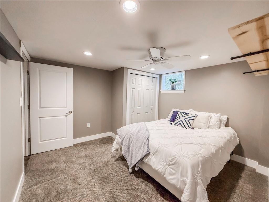 650 Lindsay Road Carnegie, PA 15106 - Photo 14 of 35 a bedroom with a bed and a chandelier