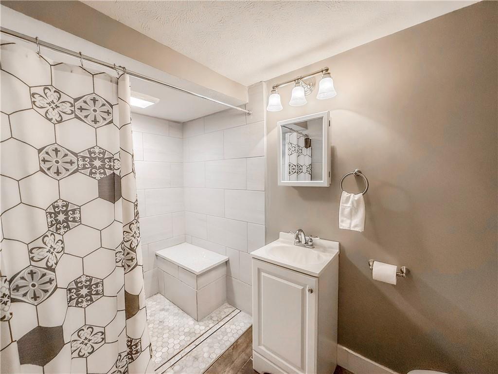 650 Lindsay Road Carnegie, PA 15106 - Photo 15 of 35 a bathroom with a sink toilet and shower