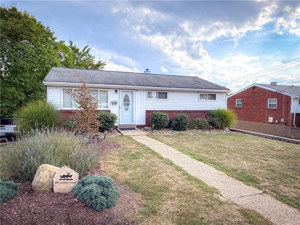 650 Lindsay Road Carnegie, PA 15106 - Photo 2 of 35 a front view of a house with garden