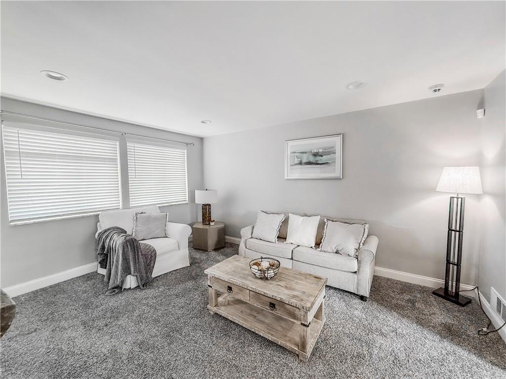 650 Lindsay Road Carnegie, PA 15106 - Photo 21 of 35 a living room with furniture a large window and a lamp