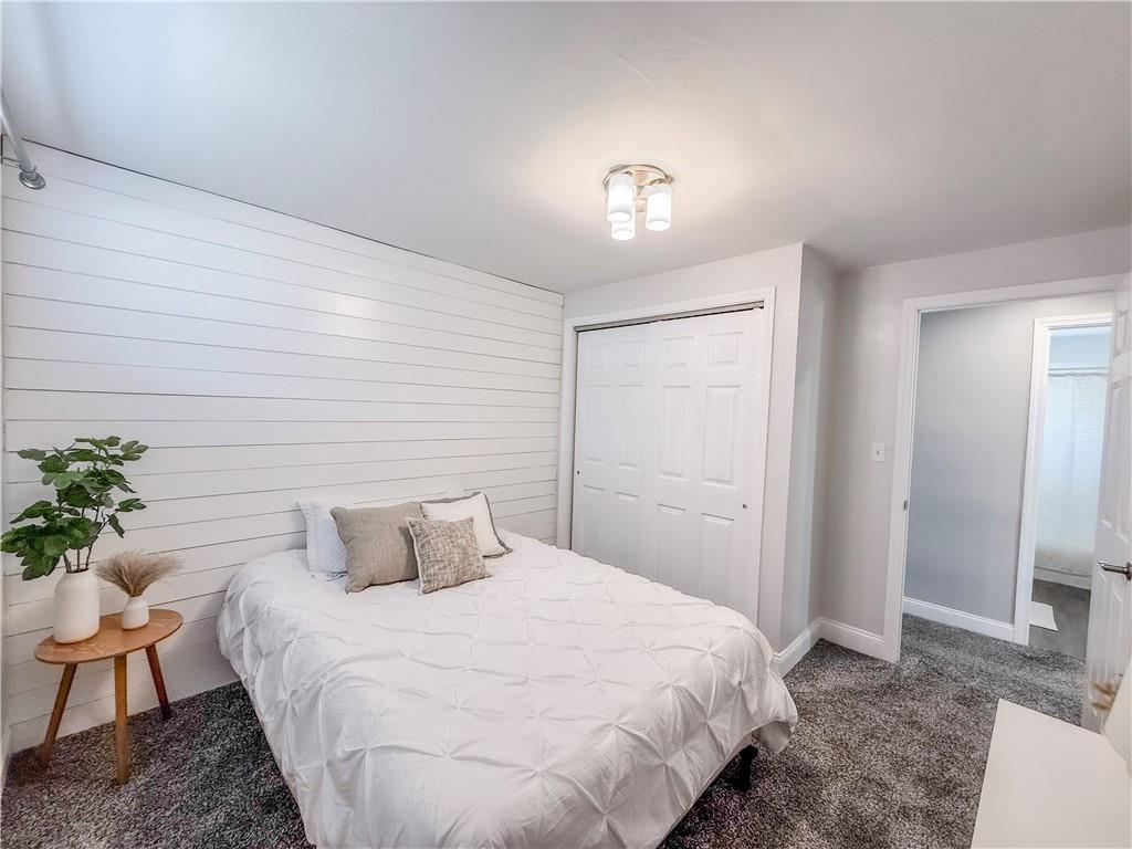 650 Lindsay Road Carnegie, PA 15106 - Photo 28 of 35 a bedroom with a bed and a potted plant