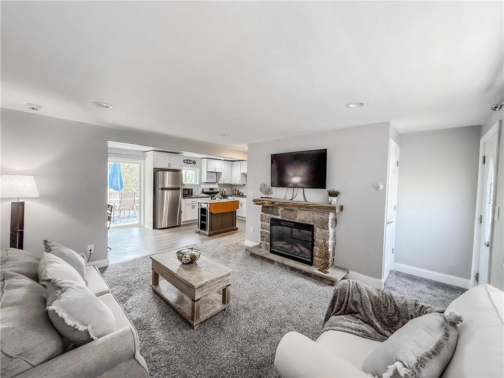 650 Lindsay Road Carnegie, PA 15106 - Photo 3 of 35 a living room with furniture flat screen tv and a fireplace