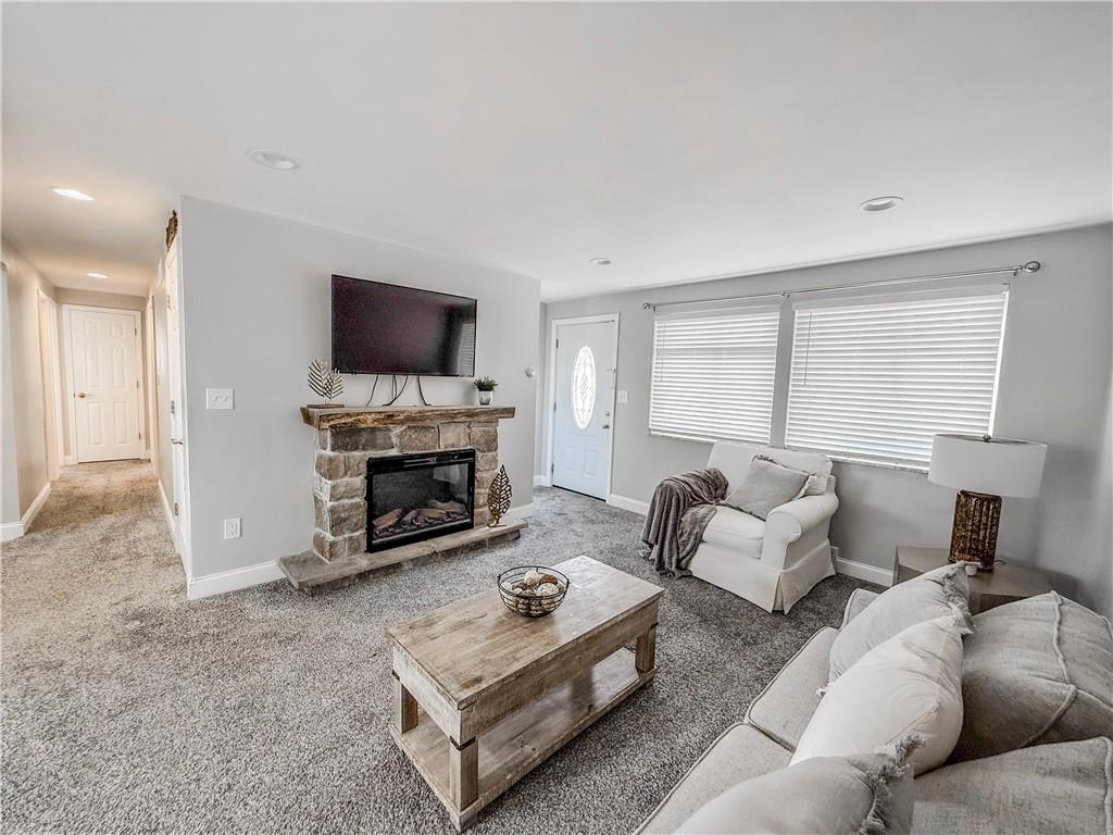 650 Lindsay Road Carnegie, PA 15106 - Photo 5 of 35 a living room with furniture and a fireplace