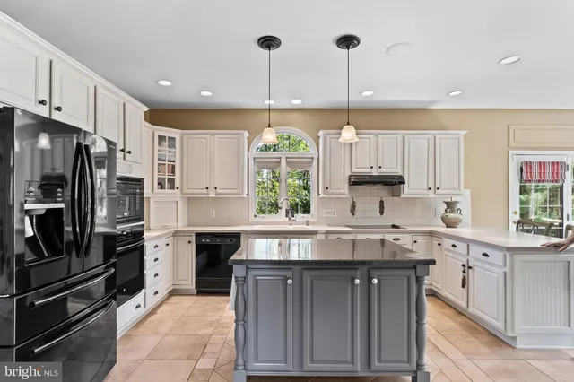 a view of an entryway with wooden floor and windows