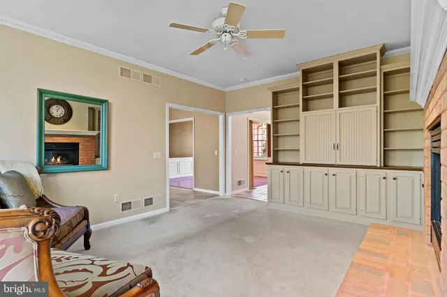 a kitchen with stainless steel appliances granite countertop a refrigerator a stove and a wooden cabinets