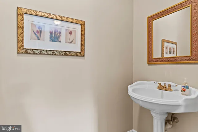a view of a room with window ceiling fan and hardwood floor
