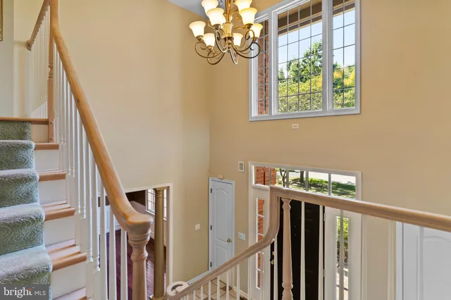 a living room with furniture ceiling fan and a window