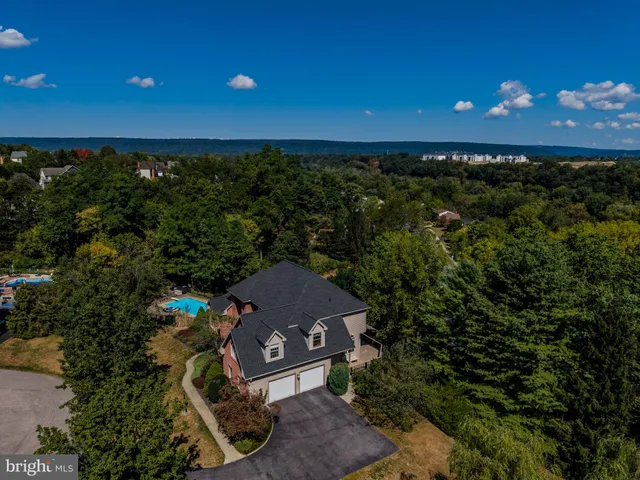 a living room with stainless steel appliances furniture and a open kitchen view
