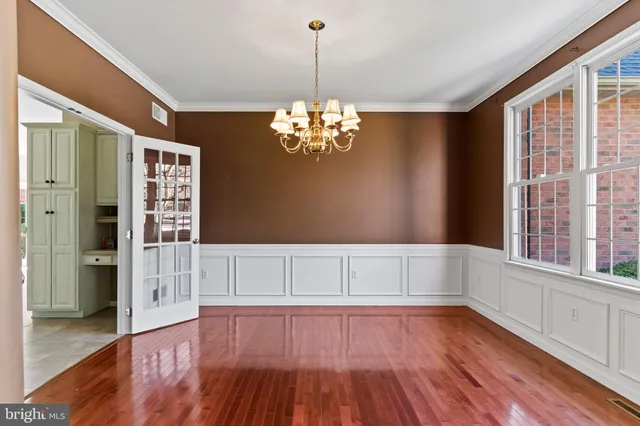 a kitchen with stainless steel appliances granite countertop a stove top oven a refrigerator a sink and a refrigerator