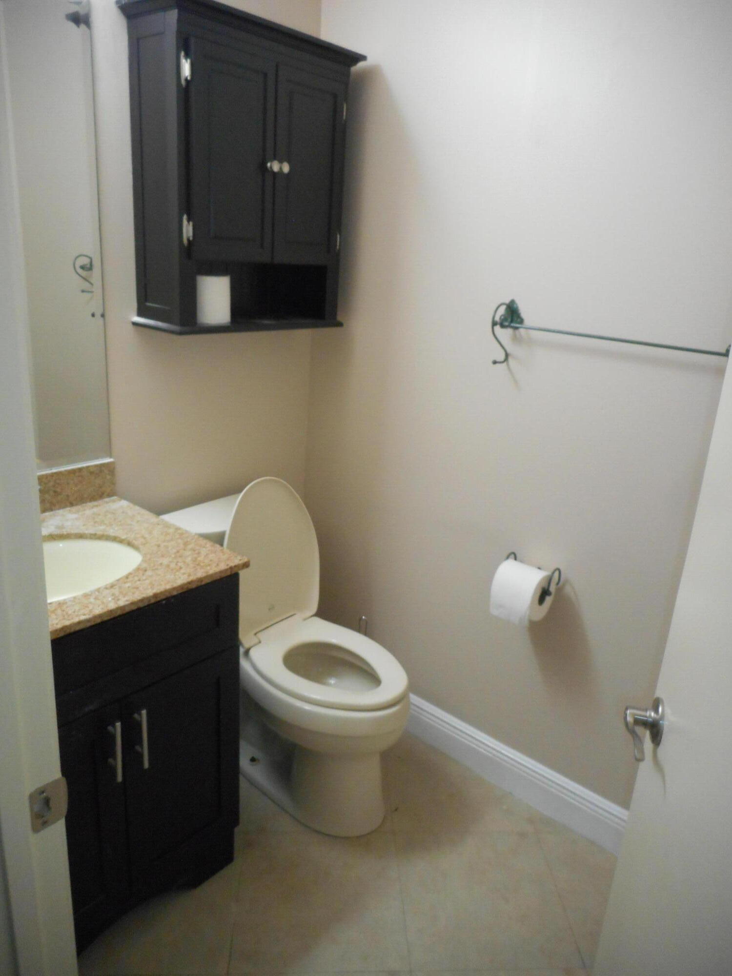 1741 Southwest 109th Terrace Davie, FL 33324 - Photo 15 of 30 a bathroom with a toilet a sink and mirror