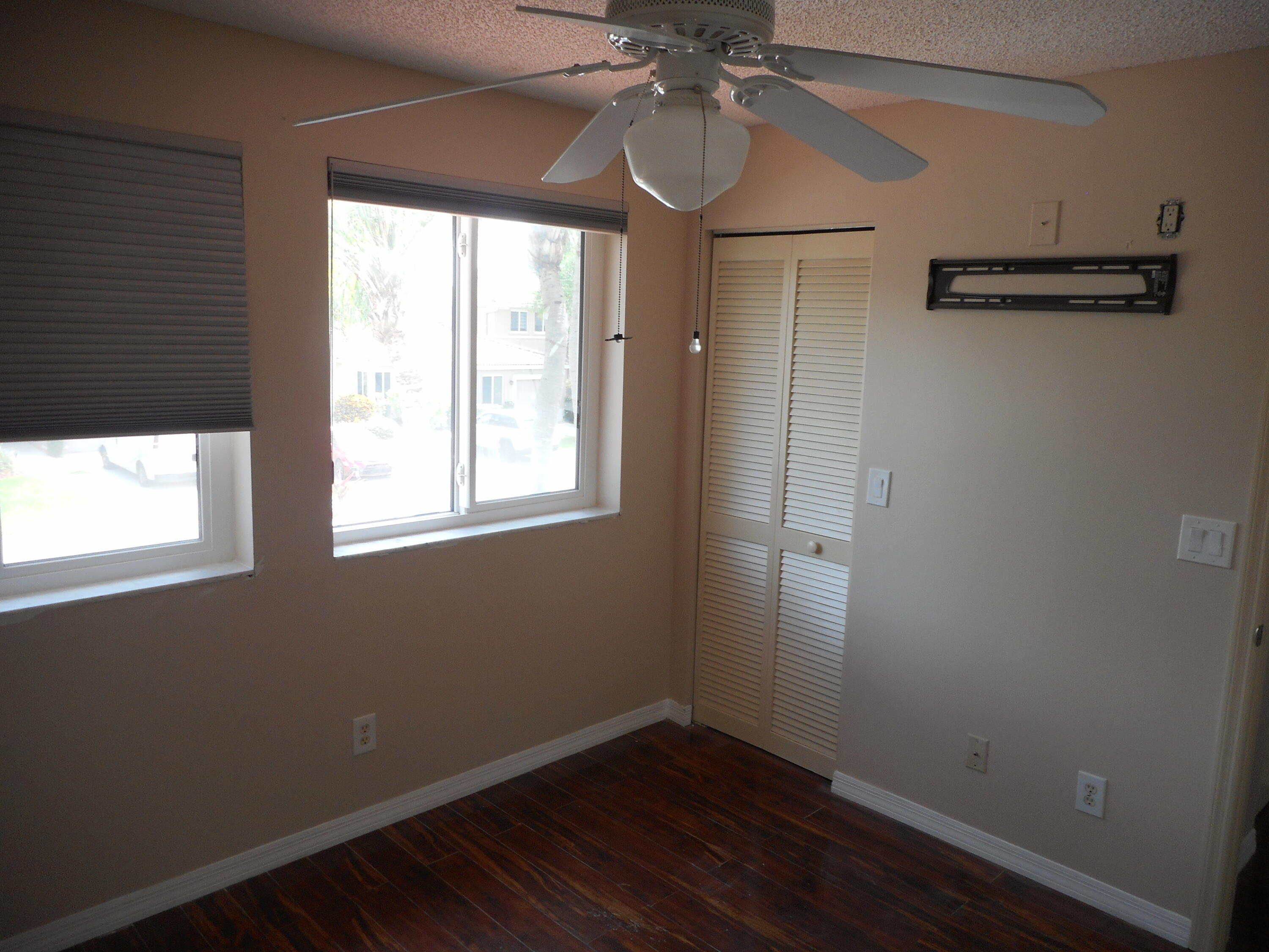 1741 Southwest 109th Terrace Davie, FL 33324 - Photo 24 of 30 a view of empty room with wooden floor and fan