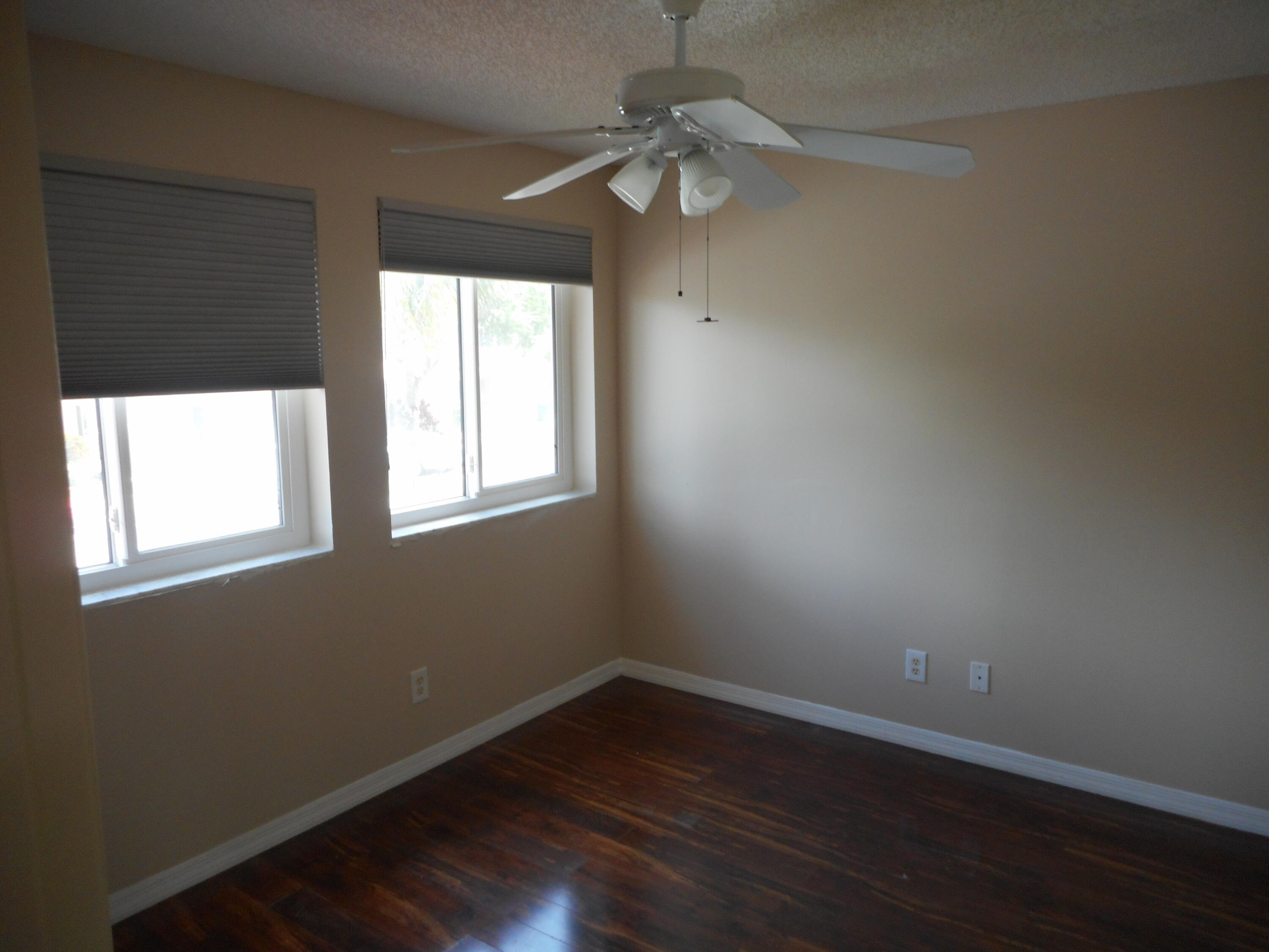 1741 Southwest 109th Terrace Davie, FL 33324 - Photo 25 of 30 an empty room with wooden floor and windows