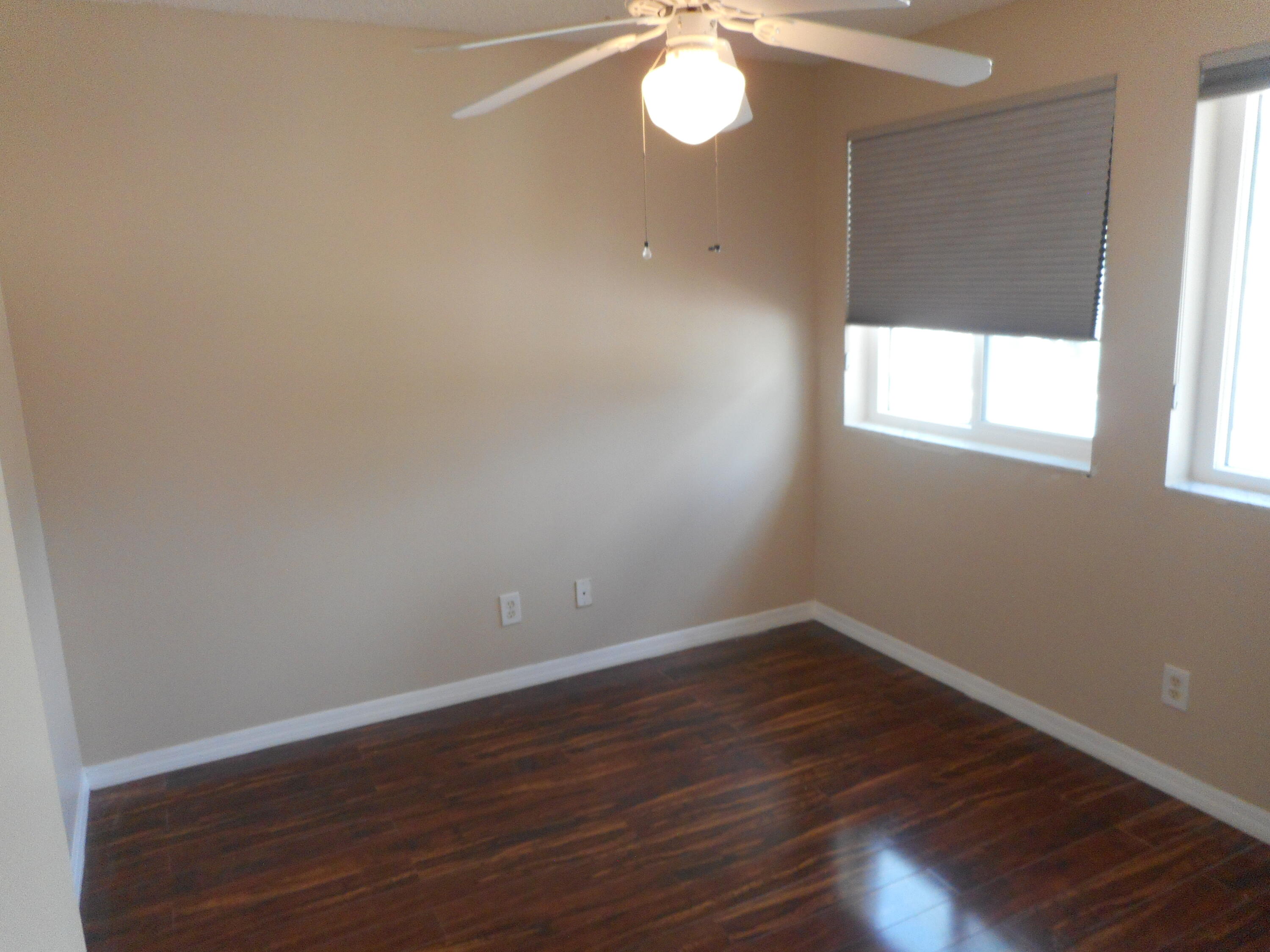 1741 Southwest 109th Terrace Davie, FL 33324 - Photo 28 of 30 an empty room with wooden floor and windows