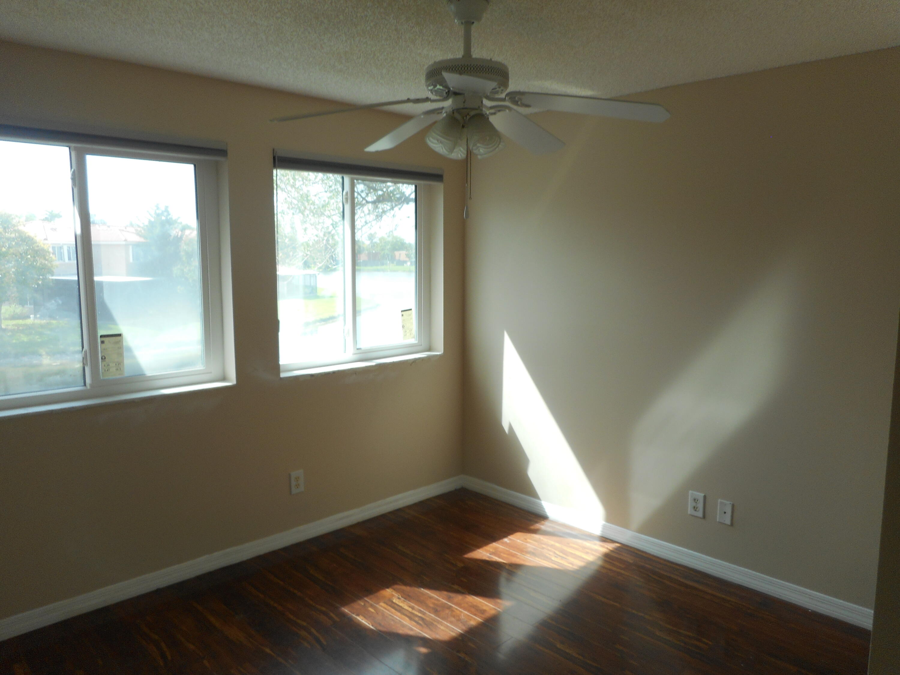 1741 Southwest 109th Terrace Davie, FL 33324 - Photo 29 of 30 an empty room with wooden floor and windows