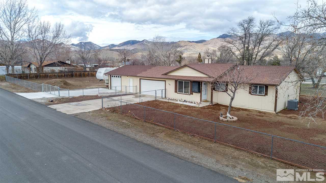 145 Ring Road Dayton, NV 89403 - Photo 1 of 17 a front view of a house with a yard
