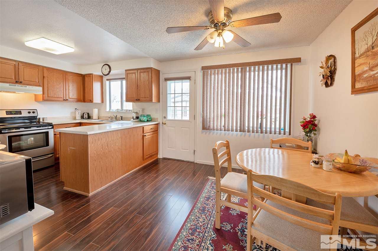 145 Ring Road Dayton, NV 89403 - Photo 4 of 17 a kitchen with sink cabinets and window