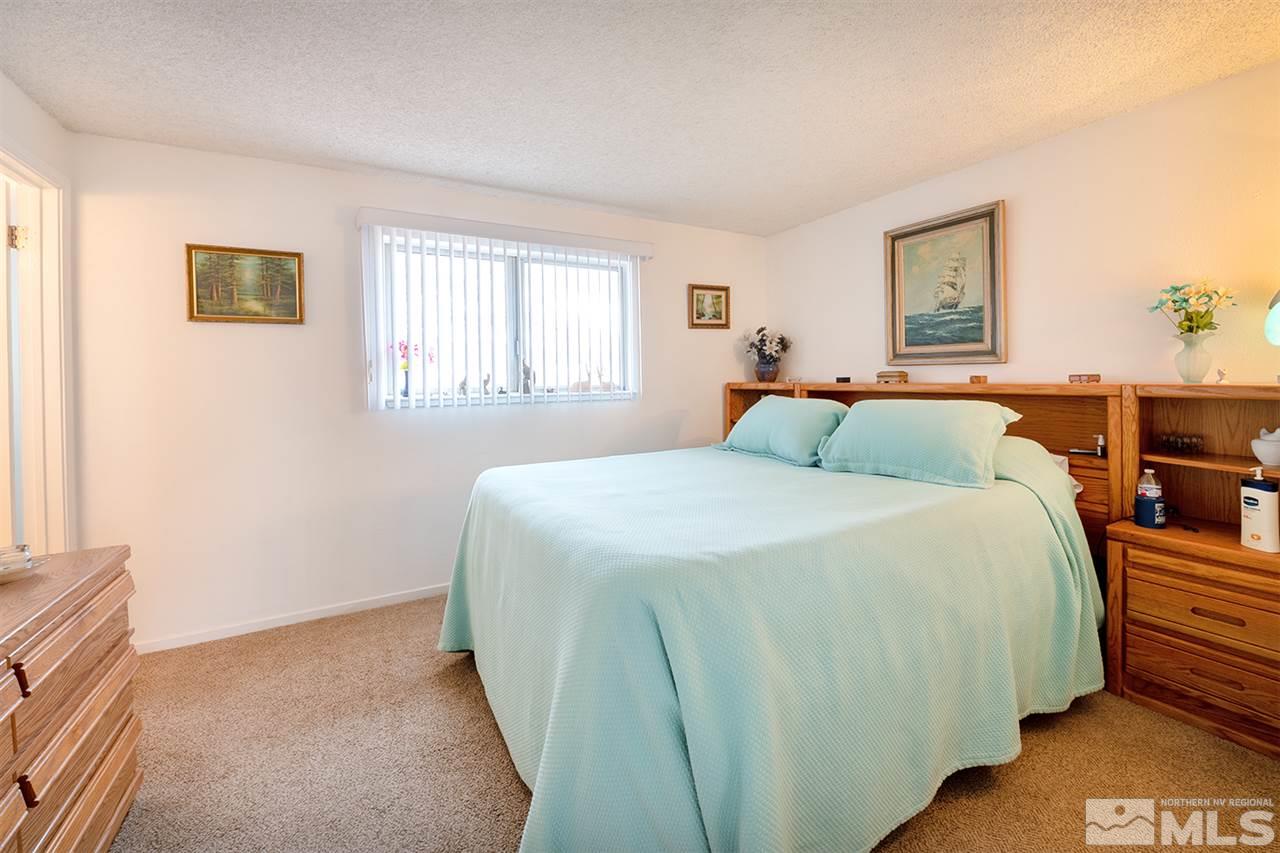 145 Ring Road Dayton, NV 89403 - Photo 6 of 17 a bedroom with a bed and window