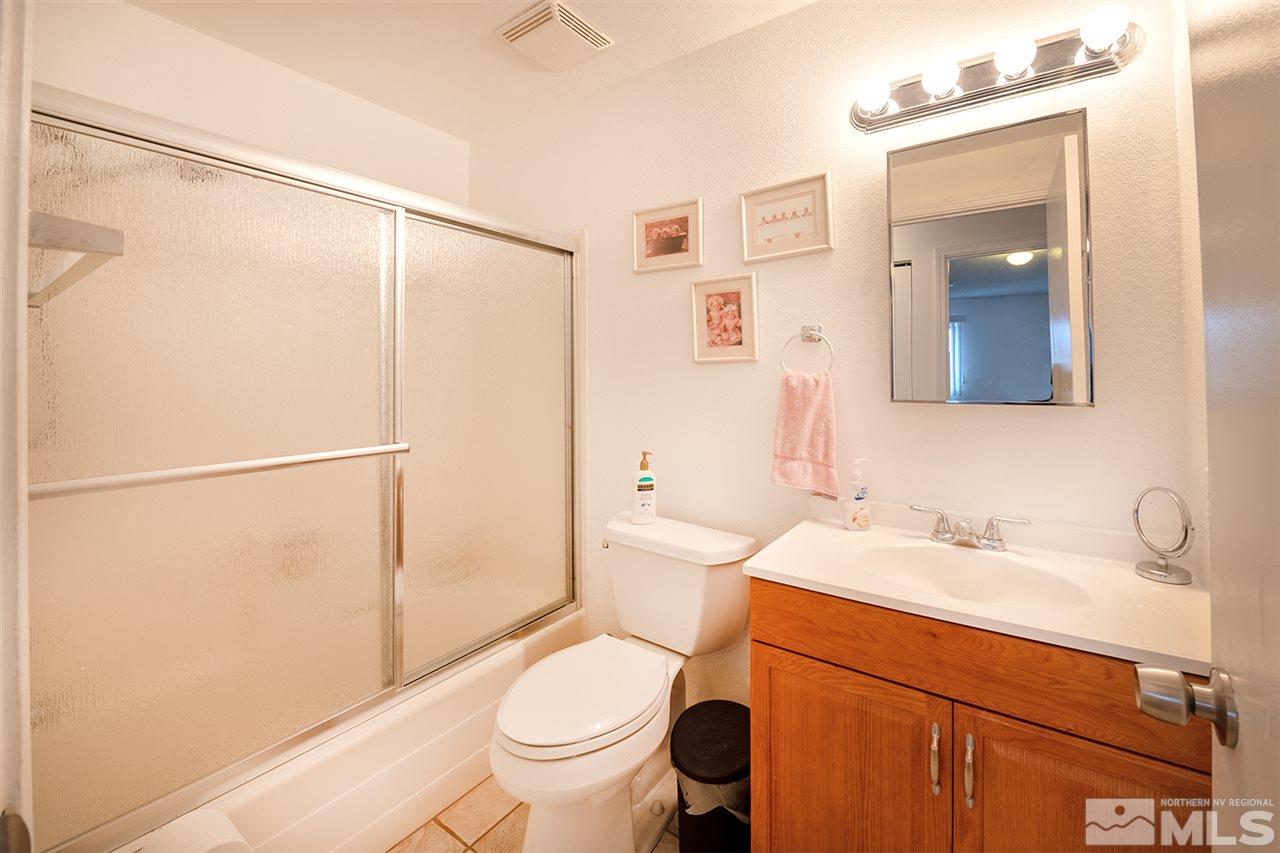 145 Ring Road Dayton, NV 89403 - Photo 7 of 17 a bathroom with a sink toilet and shower