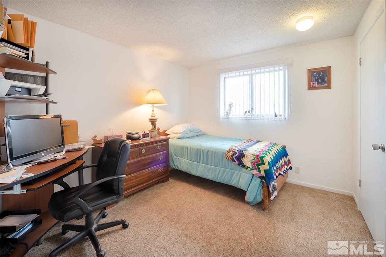 145 Ring Road Dayton, NV 89403 - Photo 10 of 17 a bedroom with a bed and a window