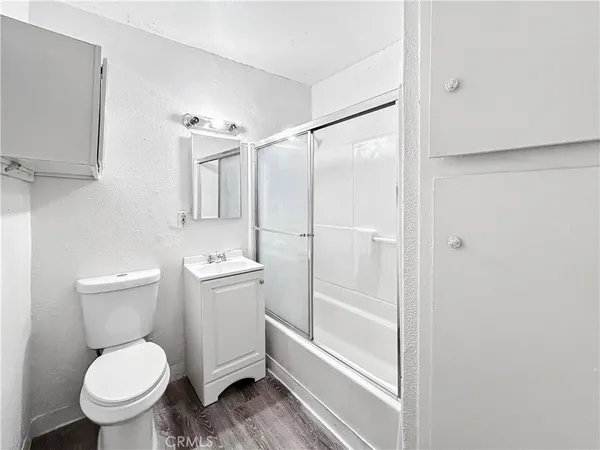 a bathroom with a toilet and shower